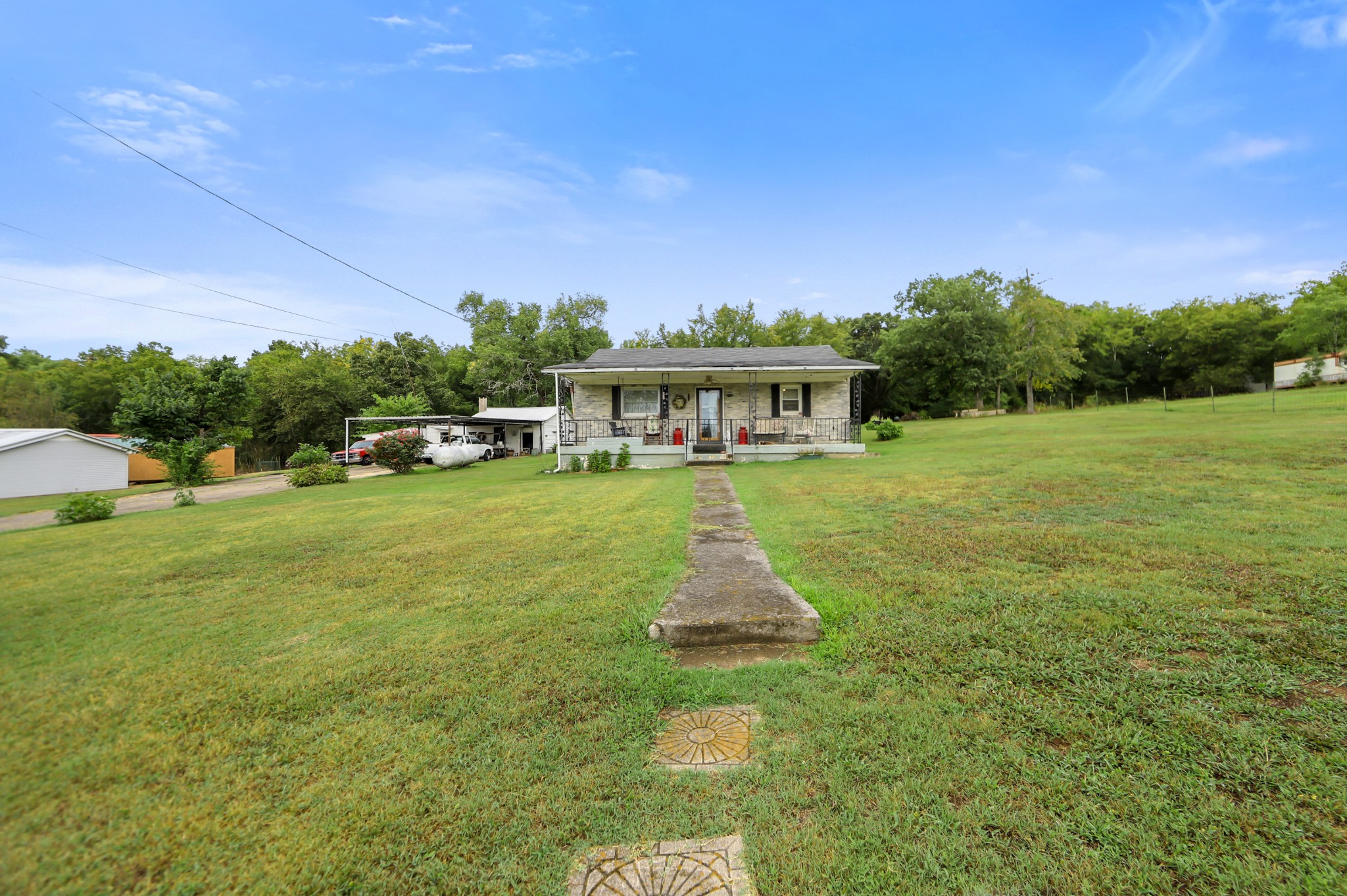 a view of a house with a big yard