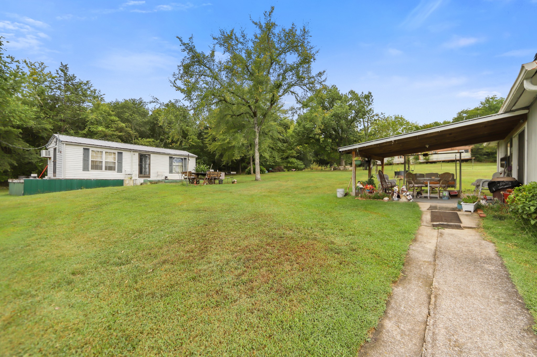 124 Shipper Road Lebanon, TN 37087 - Photo 16 of 29 a view of house with garden and trees