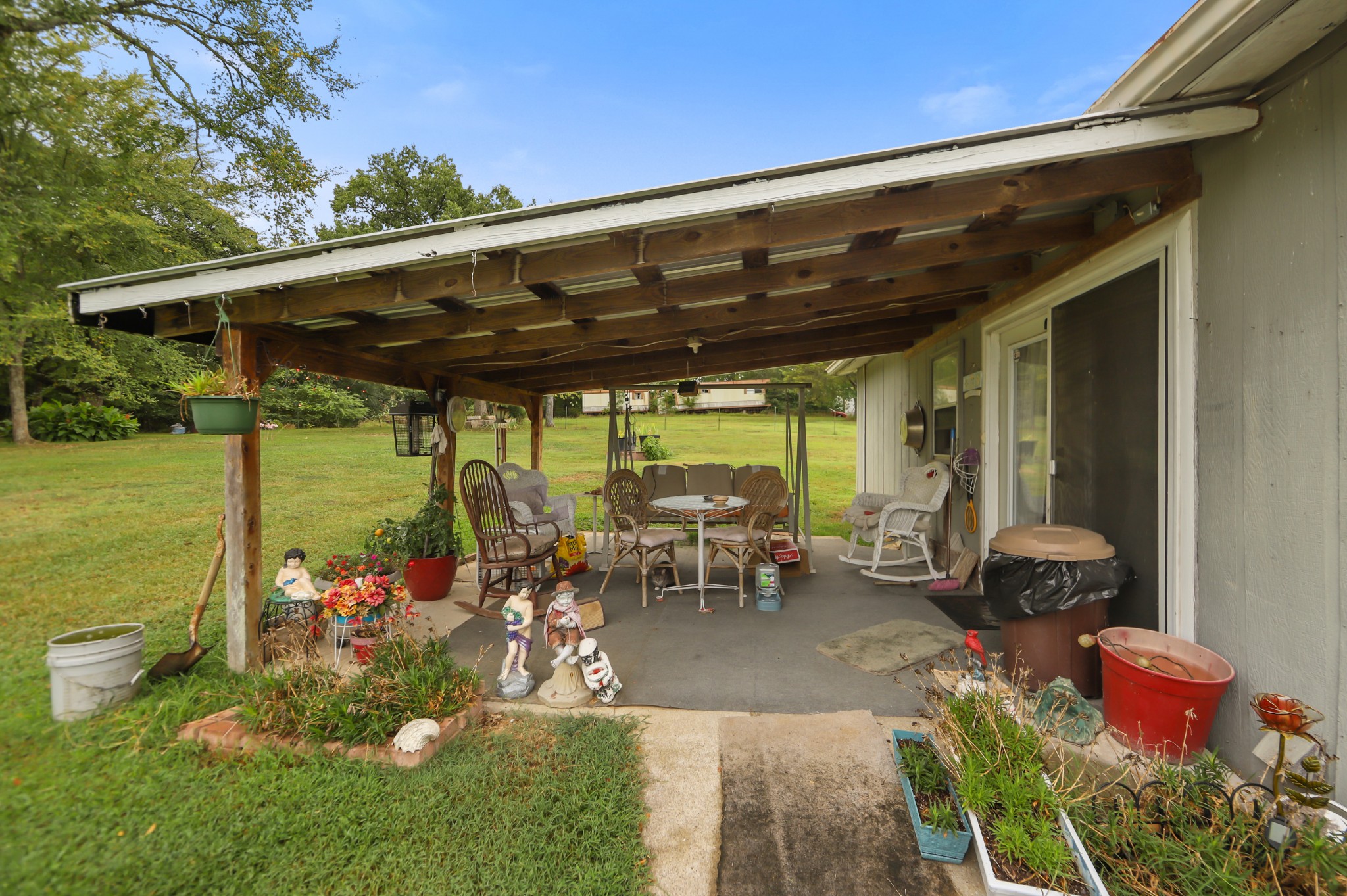 124 Shipper Road Lebanon, TN 37087 - Photo 17 of 29 a couple of table and chairs sitting in patio with umbrella