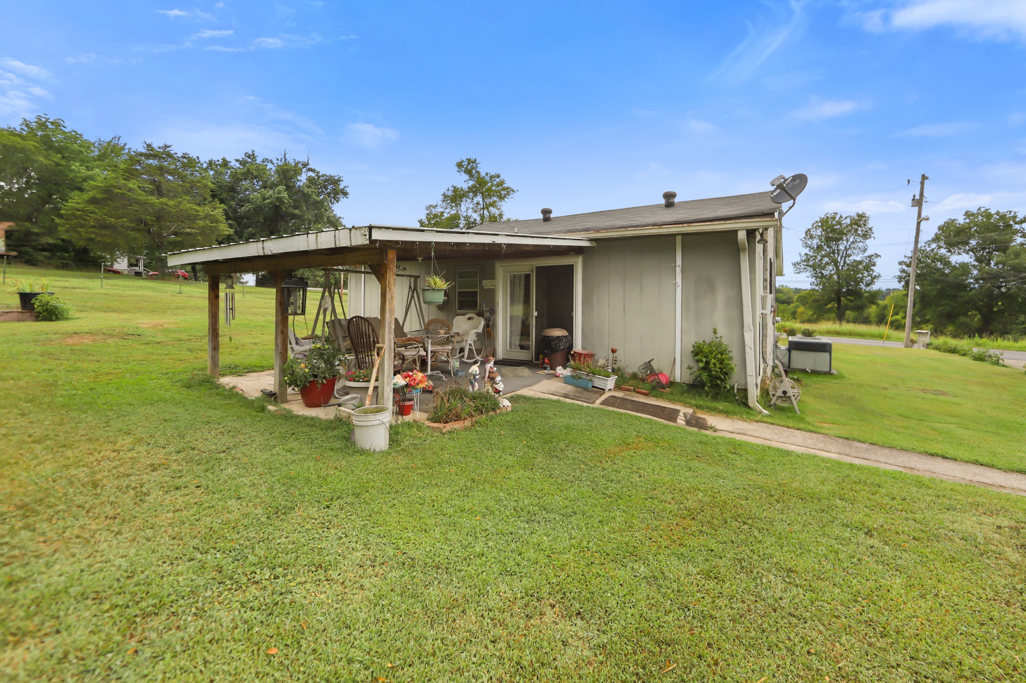 124 Shipper Road Lebanon, TN 37087 - Photo 18 of 29 a view of a house with backyard porch and sitting area