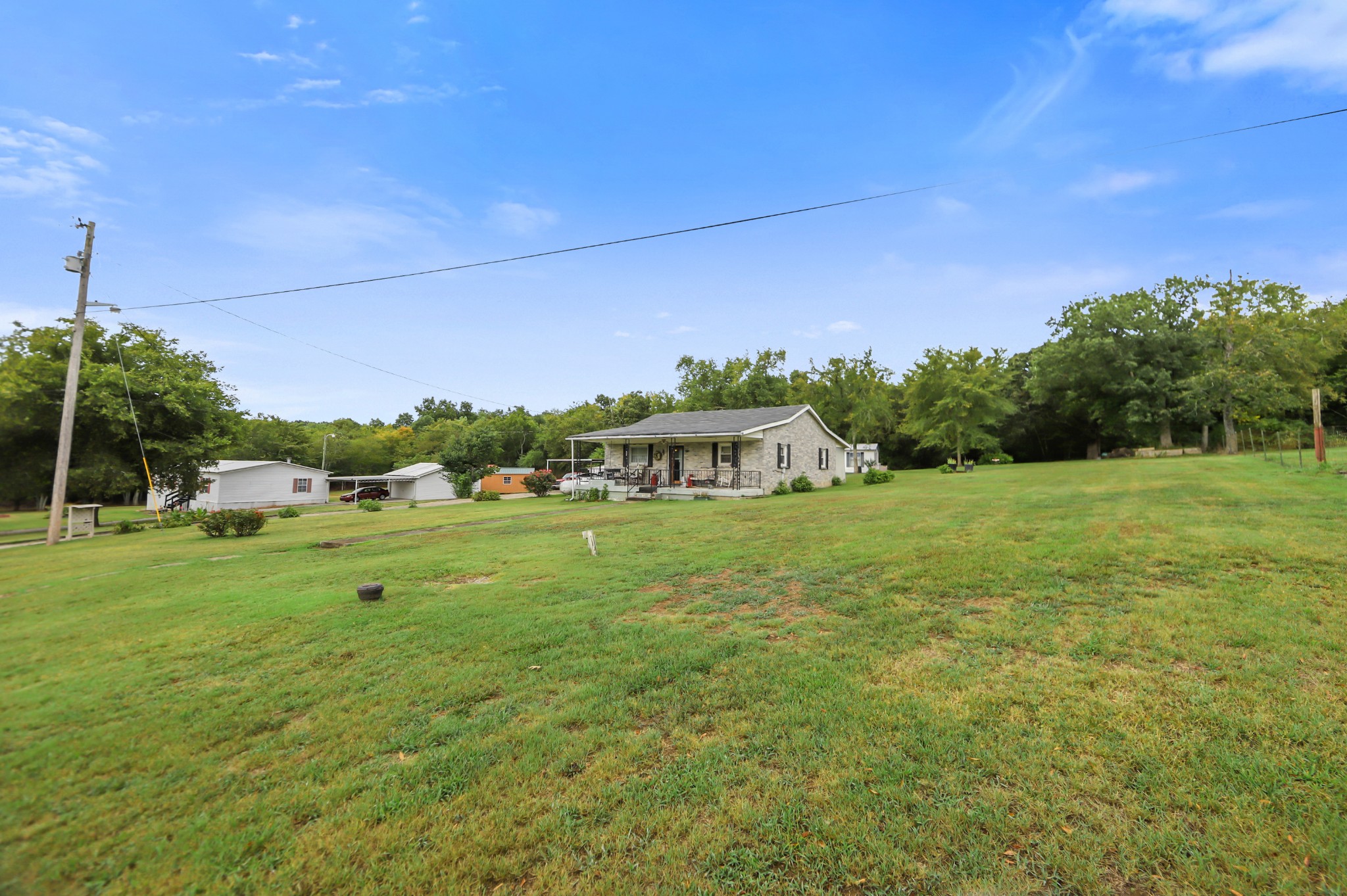 124 Shipper Road Lebanon, TN 37087 - Photo 5 of 29 a yellow building with trees in the background