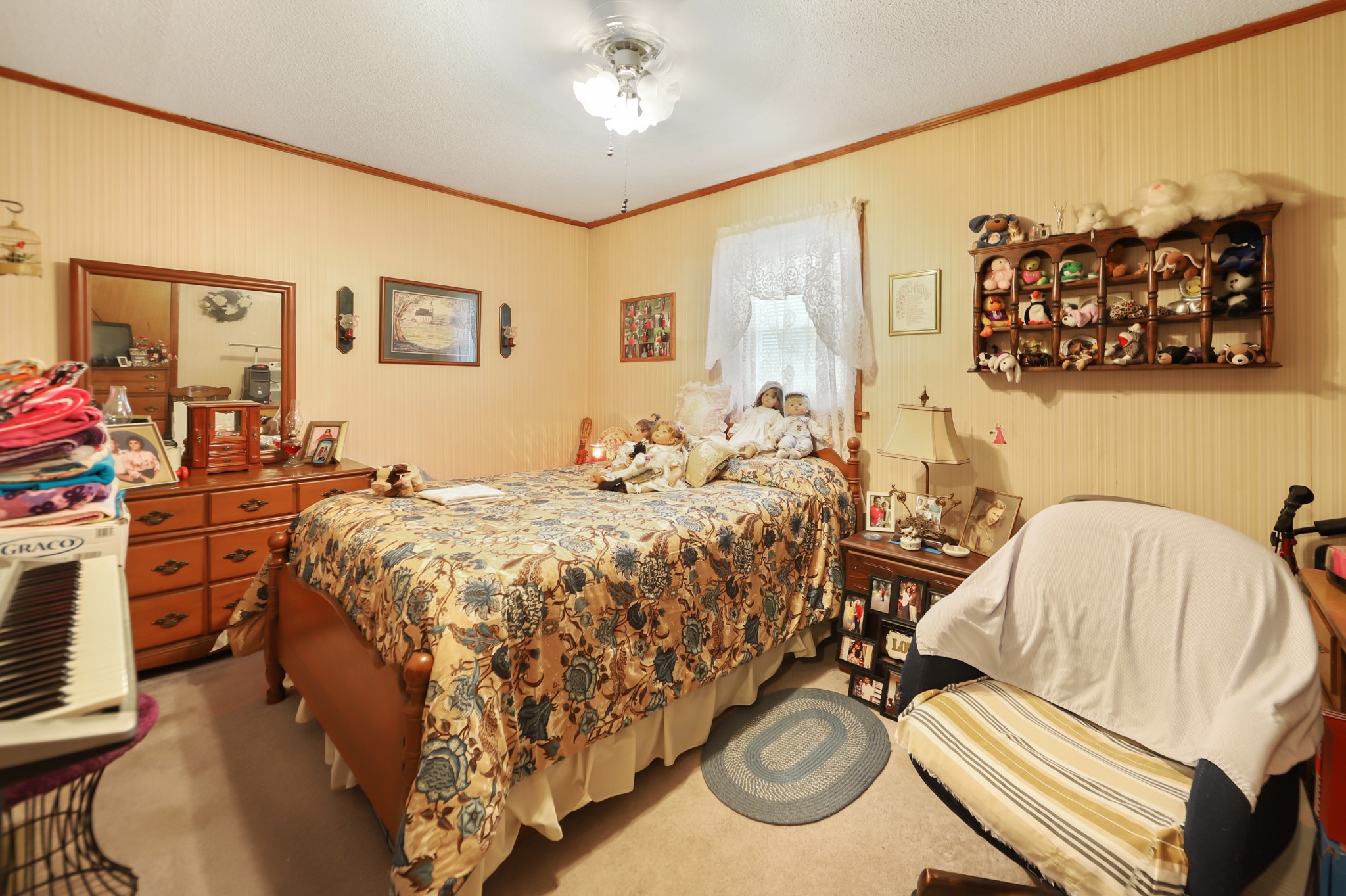 124 Shipper Road Lebanon, TN 37087 - Photo 10 of 29 a bed sitting in a bedroom next to a window and a lamp