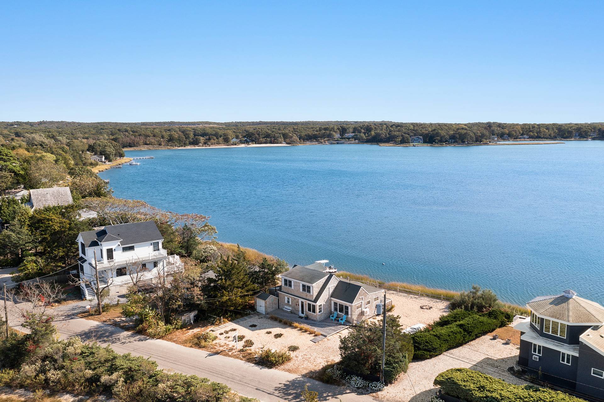238 Towd Point Road Southampton, NY 11968 - Photo 30 of 34 a view of a lake with lawn chairs