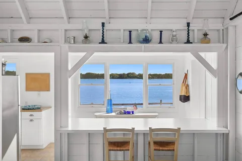 a kitchen with a stove a sink and a refrigerator