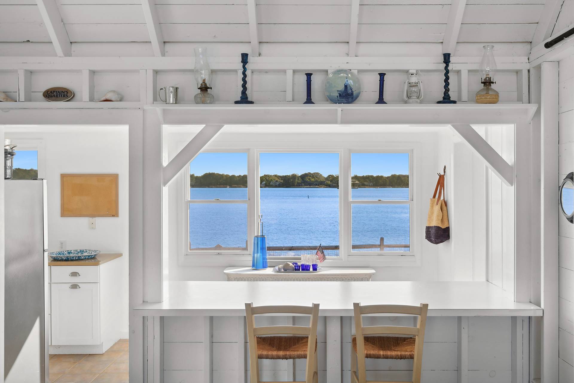 238 Towd Point Road Southampton, NY 11968 - Photo 7 of 34 a kitchen with a stove a sink and a refrigerator