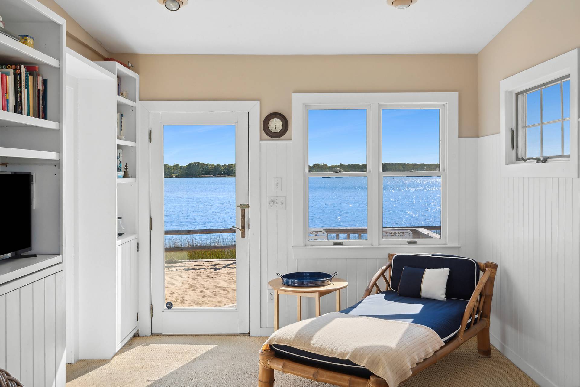 238 Towd Point Road Southampton, NY 11968 - Photo 10 of 34 a bedroom with a bed and a flat tv screen