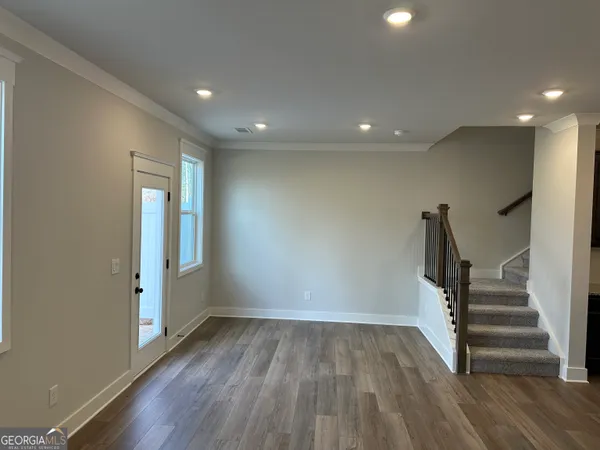 an empty room with closet and a bathroom