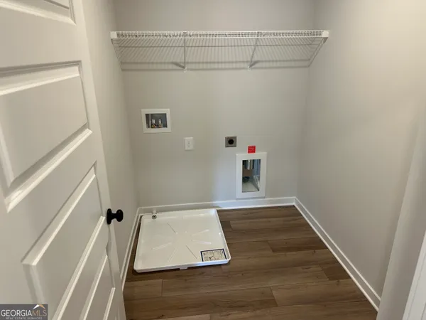 an empty room with a empty space and windows