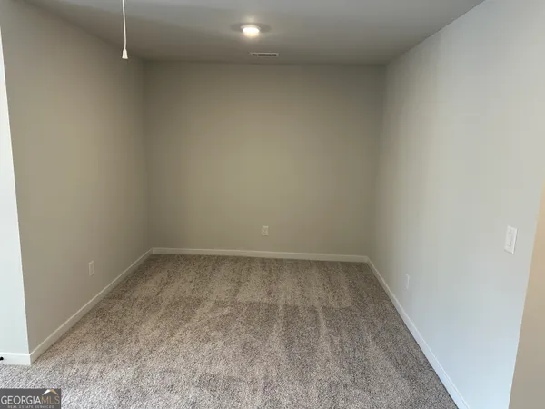 a view of a bathroom with a glass door shower