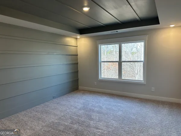 a view of a hallway with wooden shelves