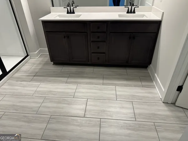 a bathroom with a toilet sink and vanity