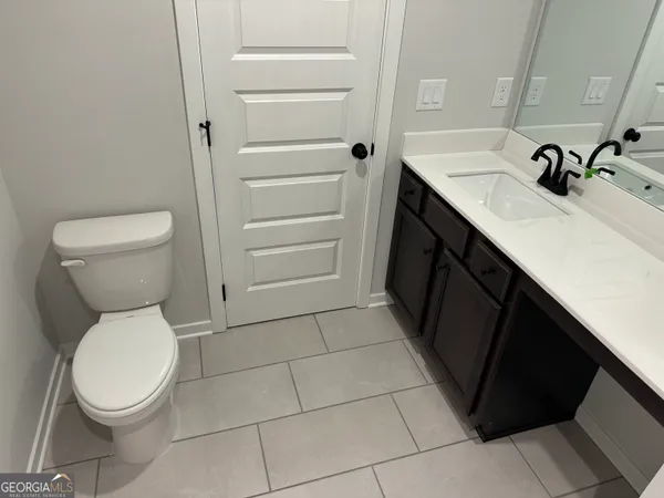 a front view of a building and car parked