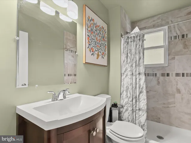 a view of a workspace with furniture and wooden floor