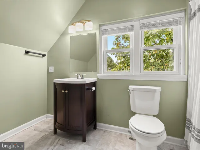 a view of a livingroom with wooden floor
