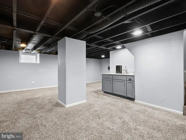a bathroom with a sink toilet and a mirror