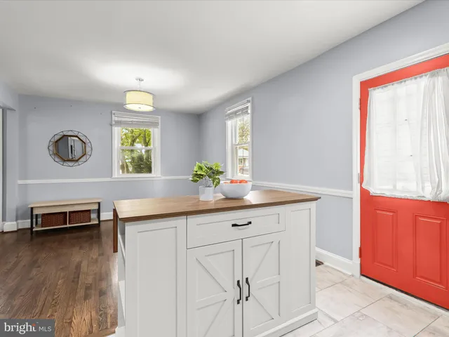 a view of backyard with swimming pool and wooden fence