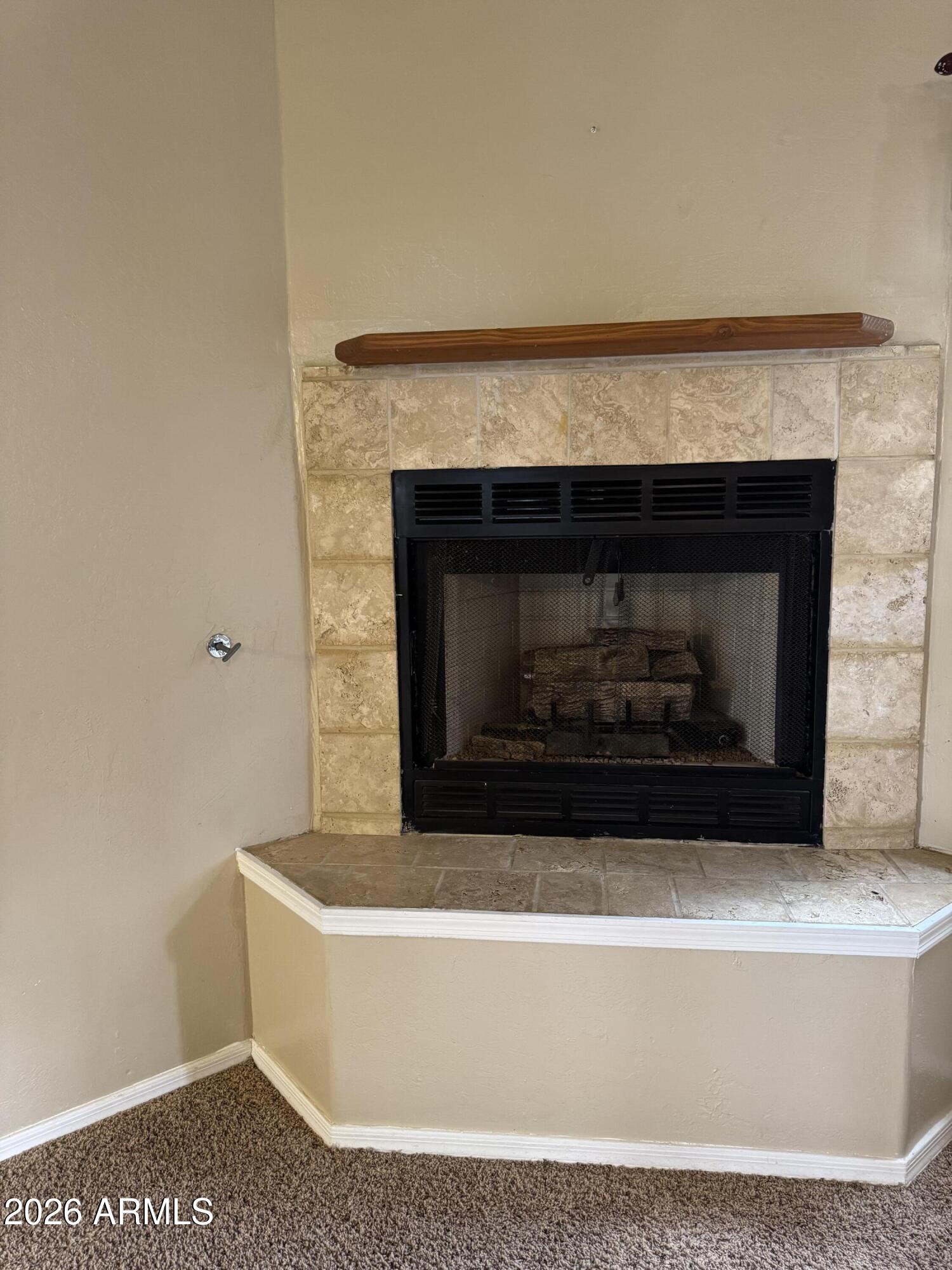 574 Walnut Creek Loop Pinetop, AZ 85935 - Photo 7 of 23 a white building with a fireplace