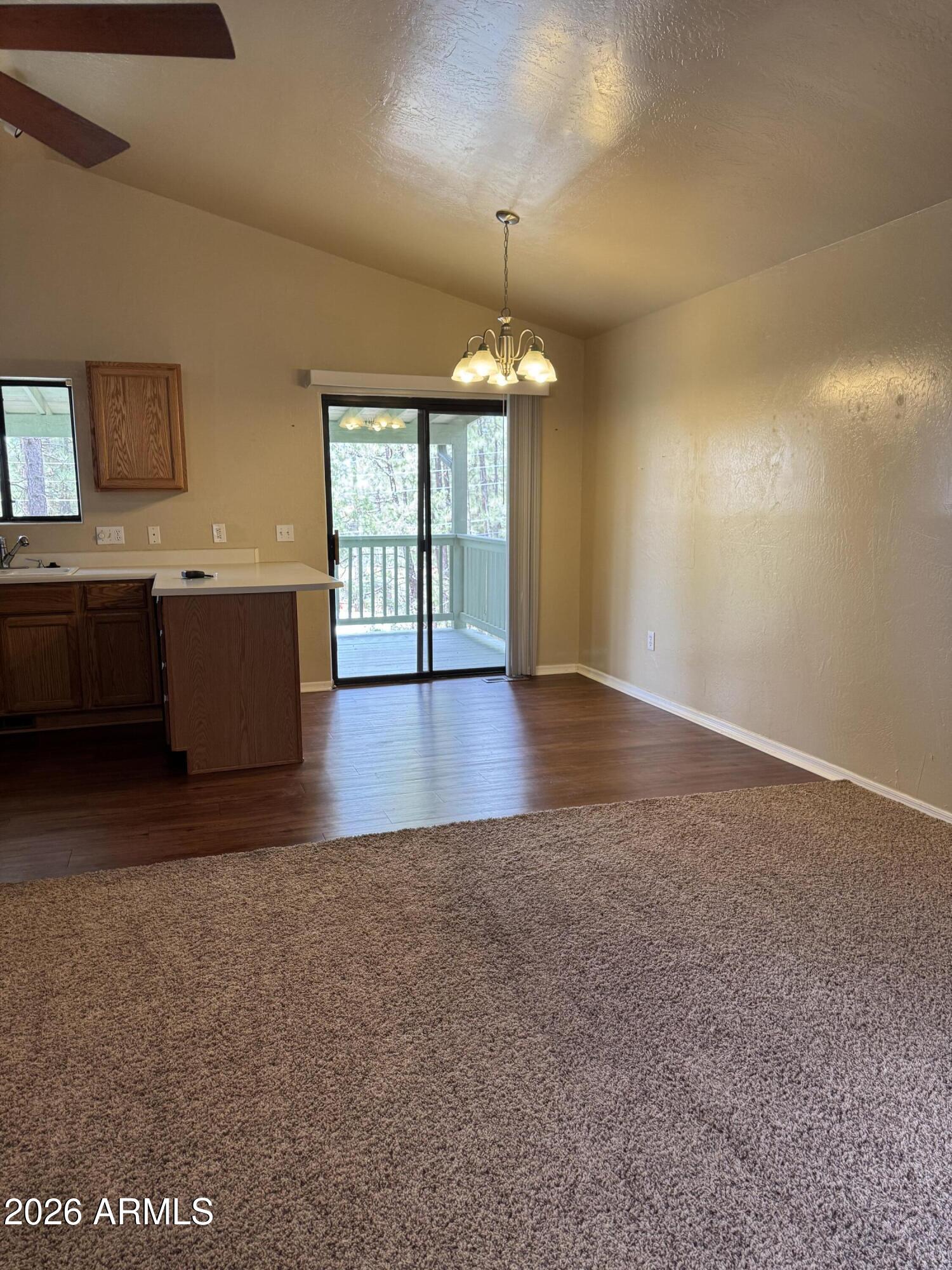 574 Walnut Creek Loop Pinetop, AZ 85935 - Photo 9 of 23 wooden floor in an empty room with a window