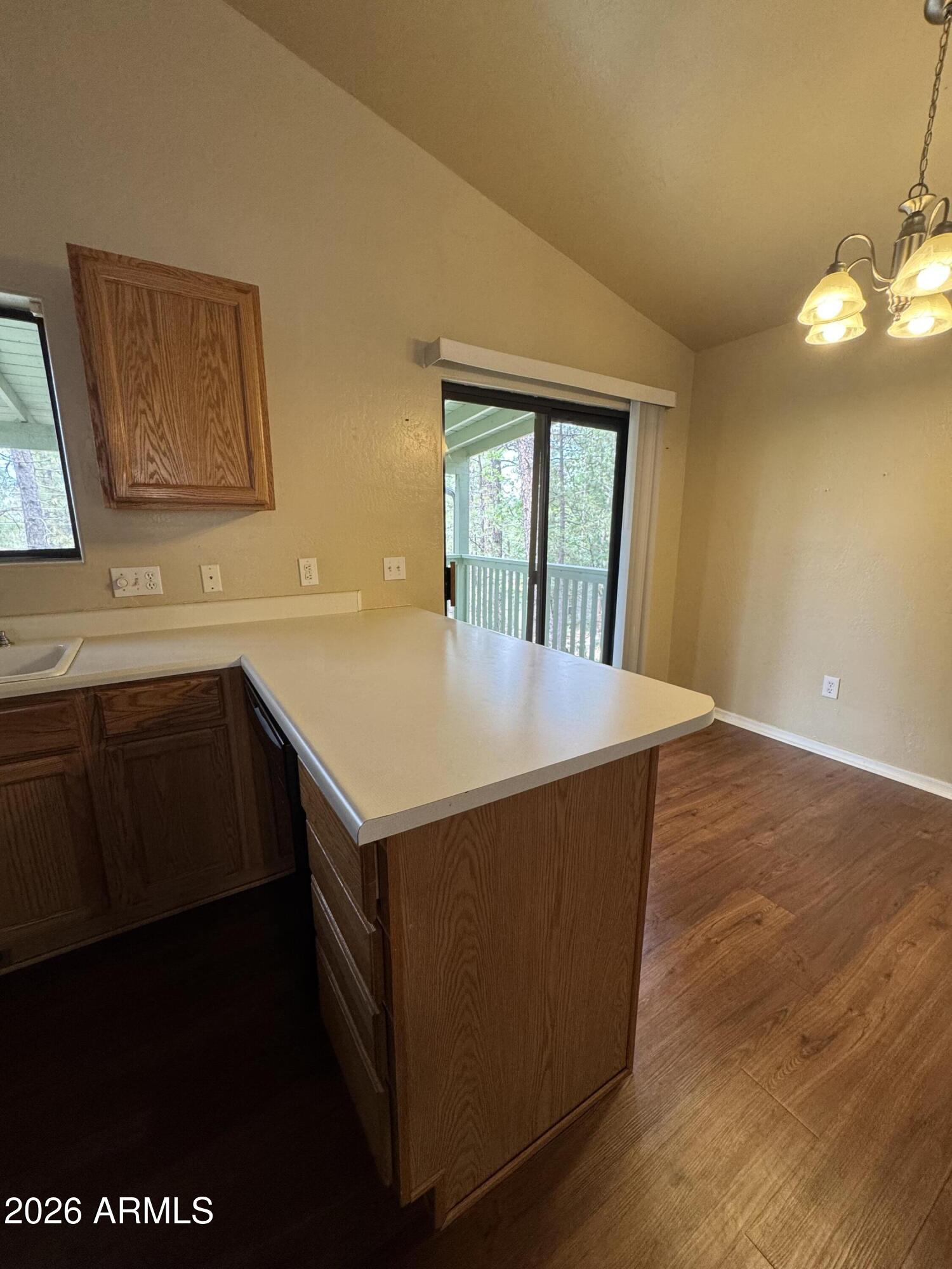 574 Walnut Creek Loop Pinetop, AZ 85935 - Photo 10 of 23 a kitchen with a sink a counter top space and cabinets