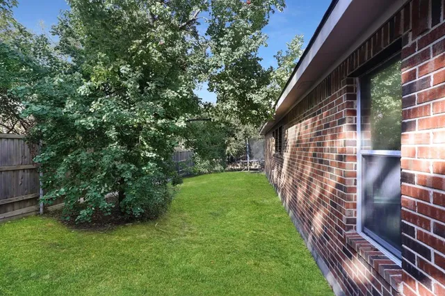a backyard of a house with lots of green space