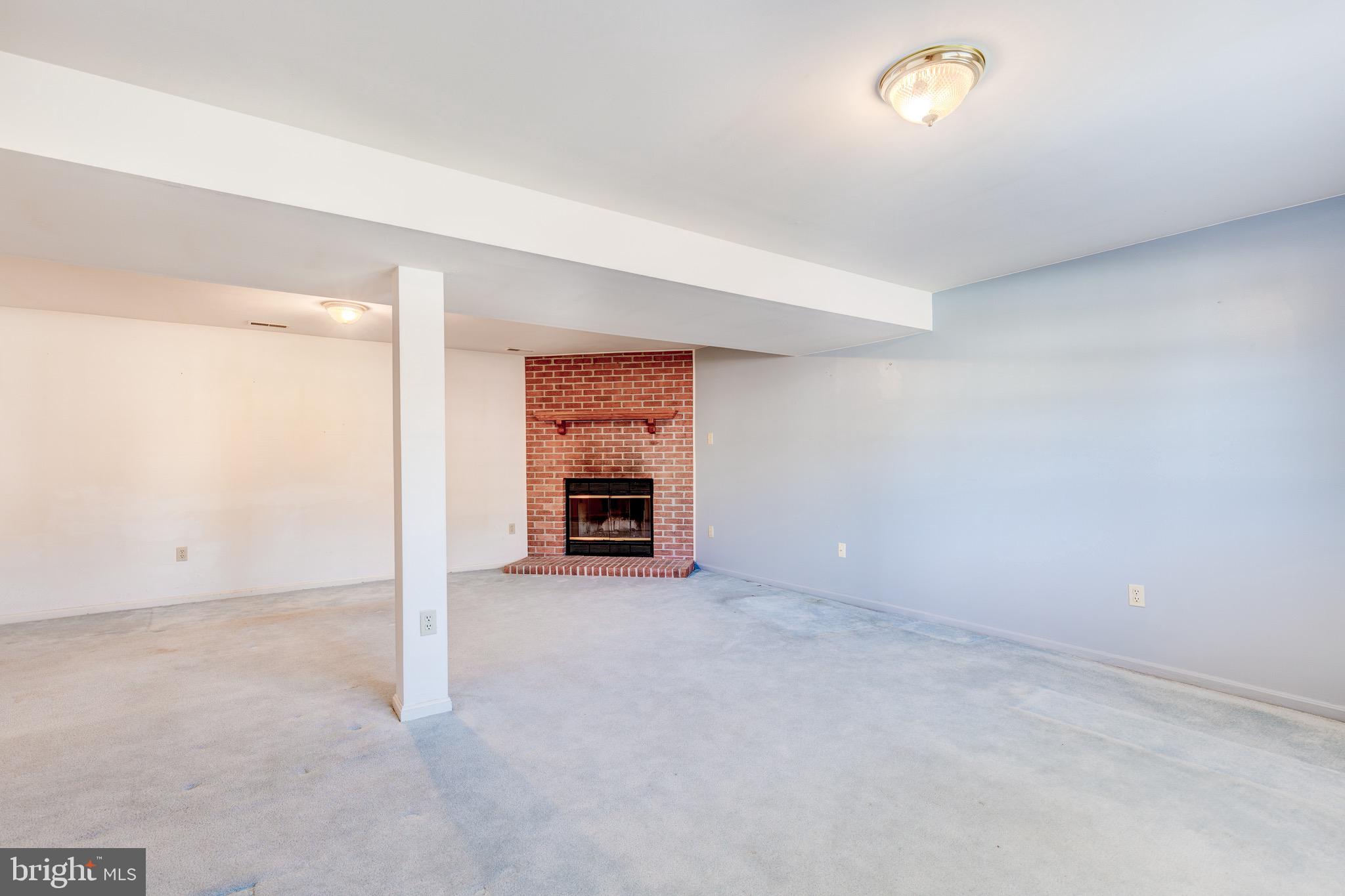 1923 Oak Lodge Road Baltimore, MD 21228 - Photo 25 of 43 Lower Level Corner Wood Burning Fireplace