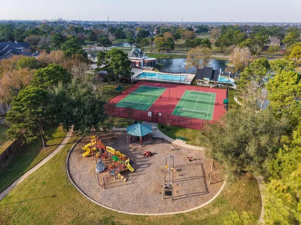 an aerial view of residential houses with outdoor space
