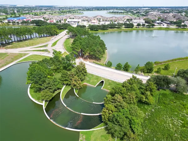 a view of a park with swings and slides