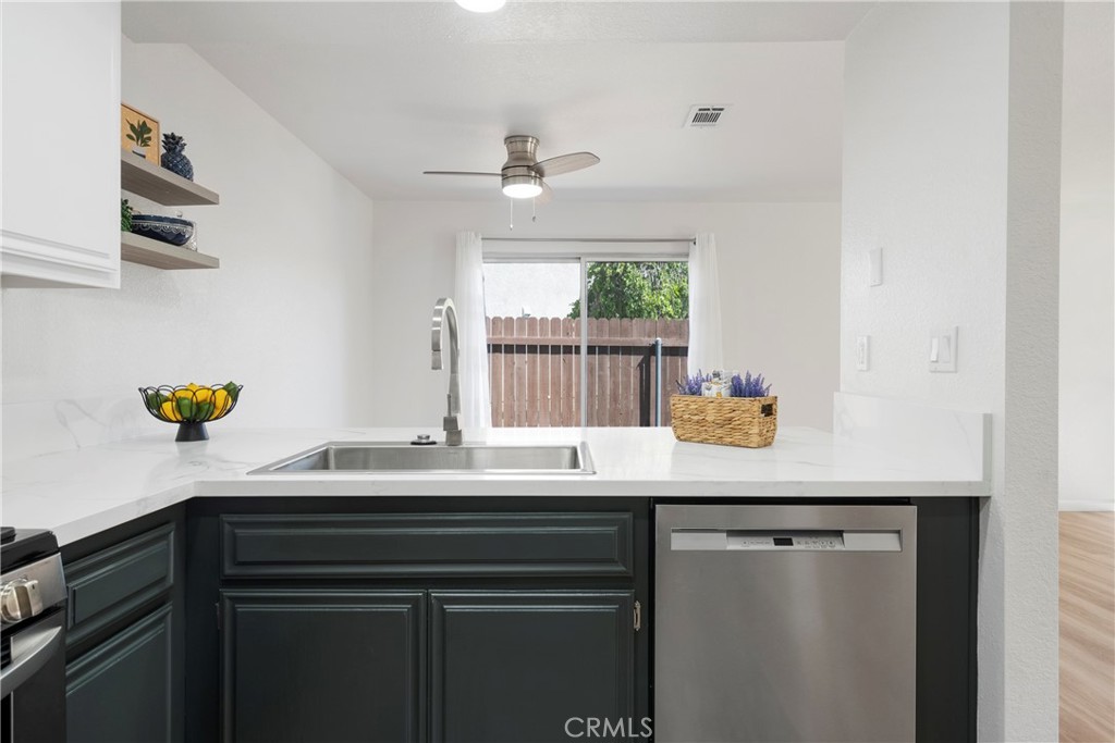 700 West 2nd Street, Unit 2 Azusa, CA 91702 - Photo 15 of 39 a kitchen with a sink a counter space and cabinets