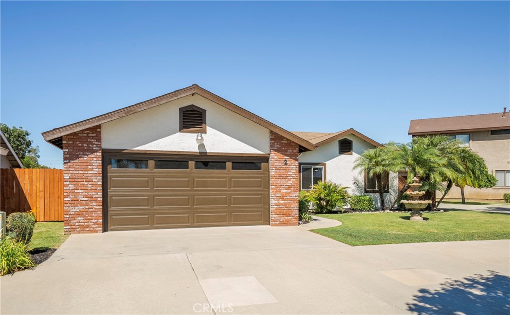 700 West 2nd Street, Unit 2 Azusa, CA 91702 - Photo 2 of 39 a front view of a house with a yard