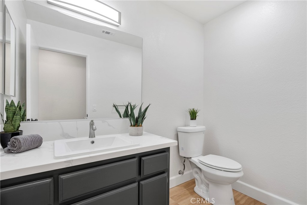 700 West 2nd Street, Unit 2 Azusa, CA 91702 - Photo 21 of 39 a bathroom with a sink a toilet and potted plant