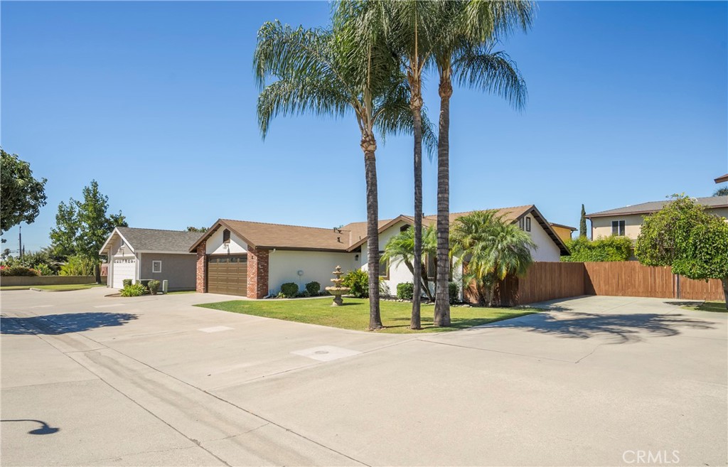 700 West 2nd Street, Unit 2 Azusa, CA 91702 - Photo 5 of 39 a view of a house with a yard and palm trees