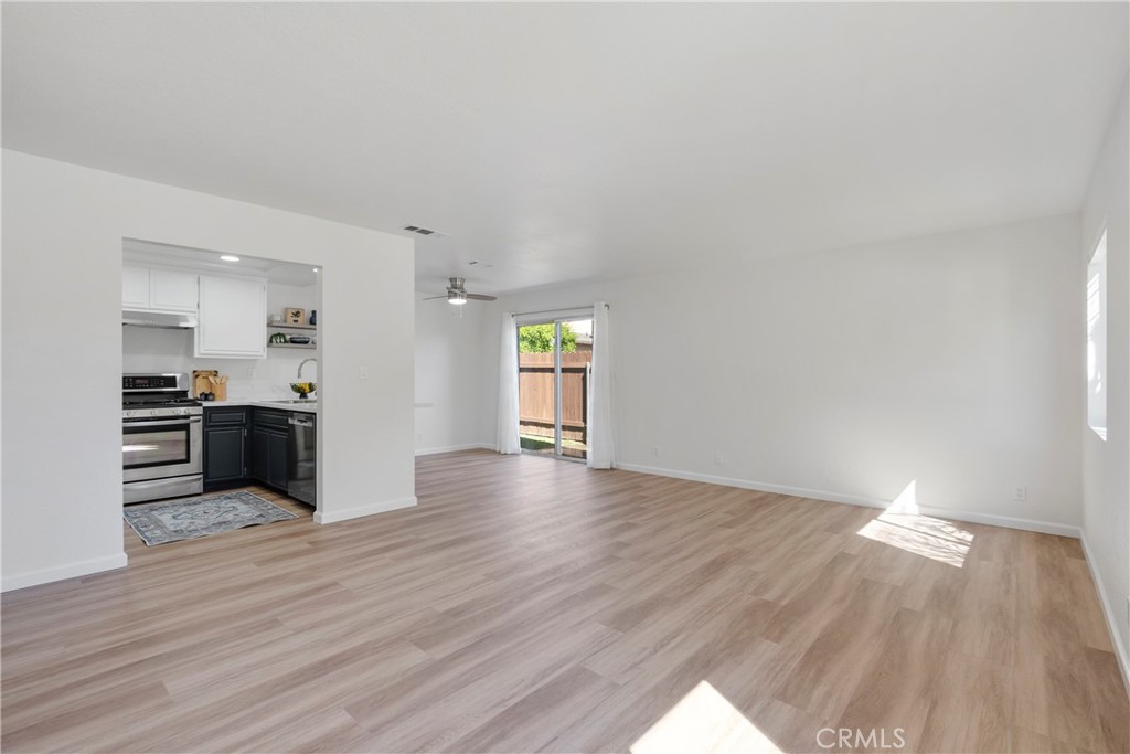 700 West 2nd Street, Unit 2 Azusa, CA 91702 - Photo 8 of 39 a view of a kitchen with wooden floor and electronic appliances