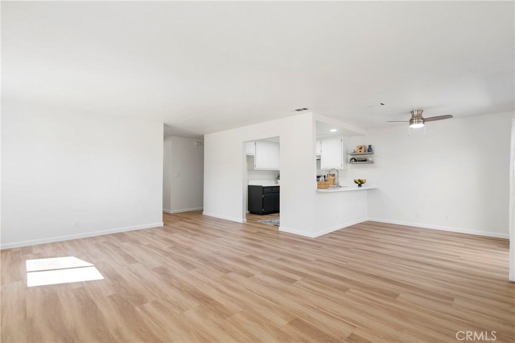 700 West 2nd Street, Unit 2 Azusa, CA 91702 - Photo 10 of 39 a view of a kitchen with wooden floor and kitchen space