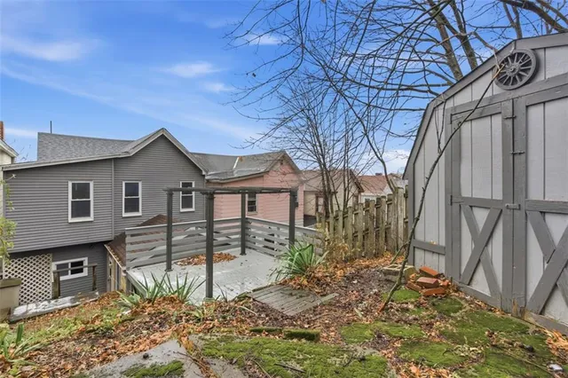 a view of a backyard of the house