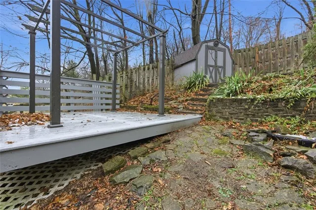a front view of a house with iron fence