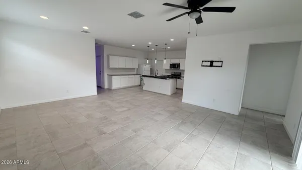 a view of a kitchen with a sink and cabinets