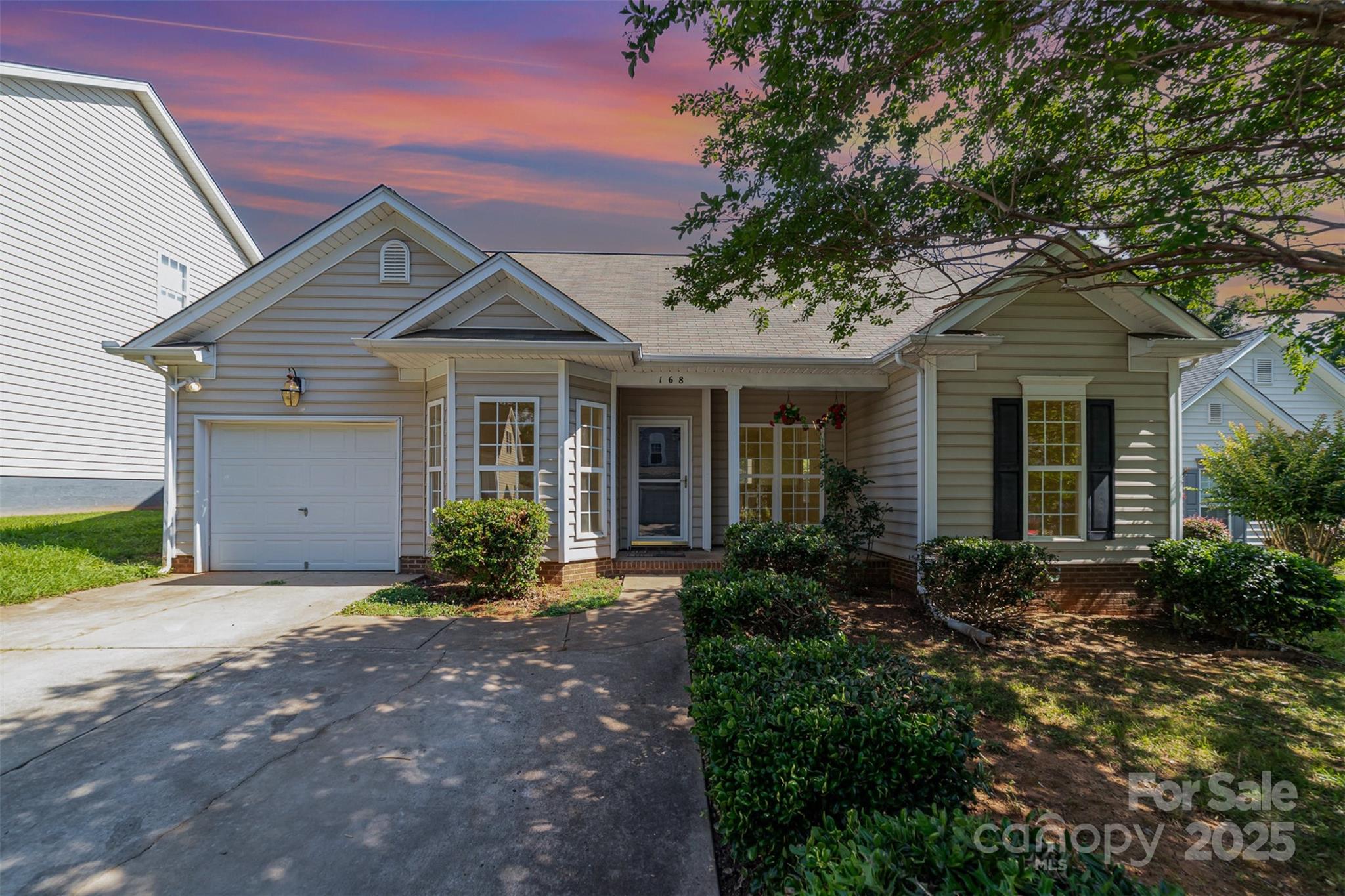 168 Devon Forest Drive Mooresville, NC 28115 - Photo 1 of 21 a front view of a house with a yard and outdoor seating