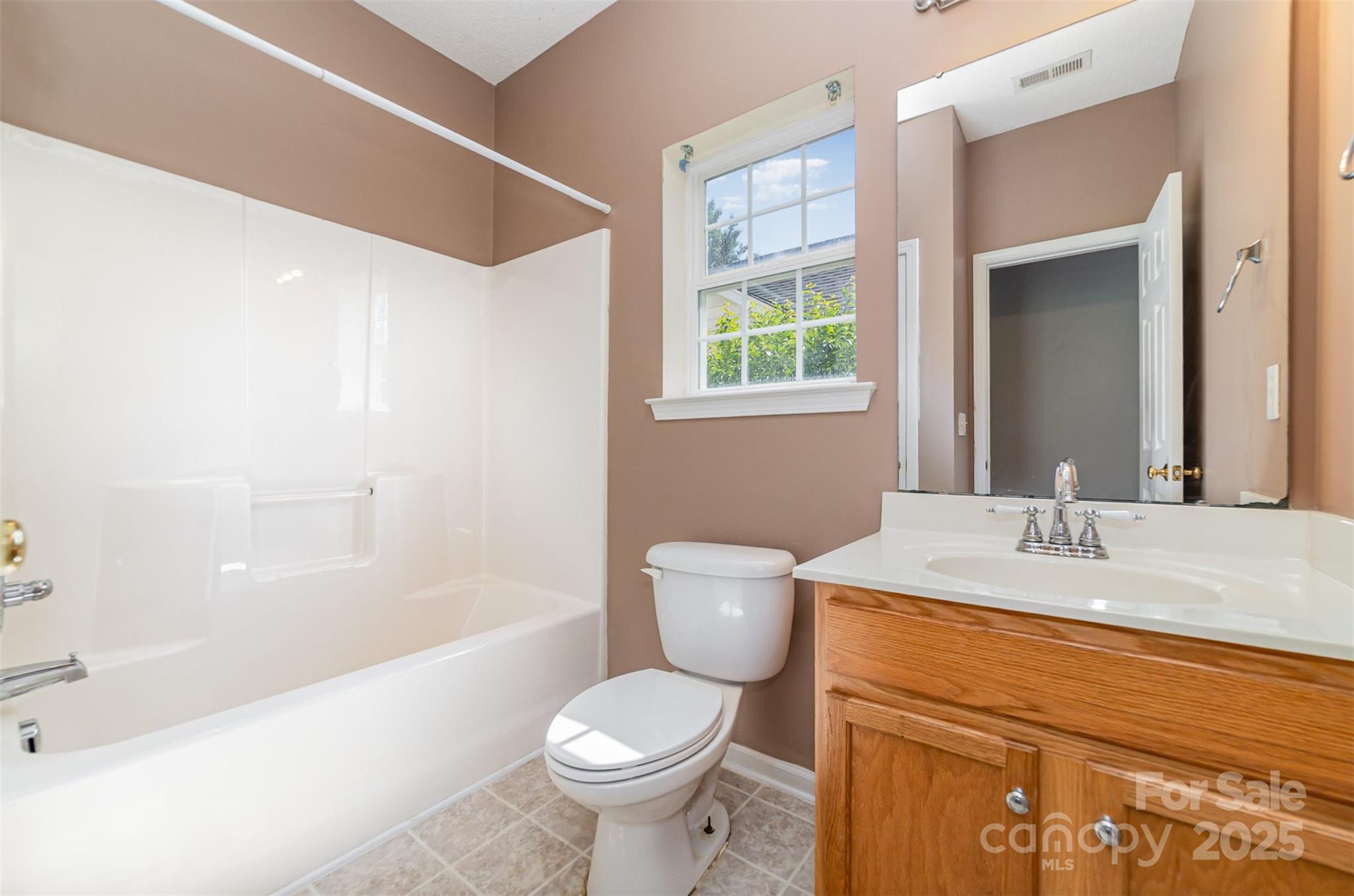 168 Devon Forest Drive Mooresville, NC 28115 - Photo 15 of 21 a bathroom with a sink toilet and bathtub