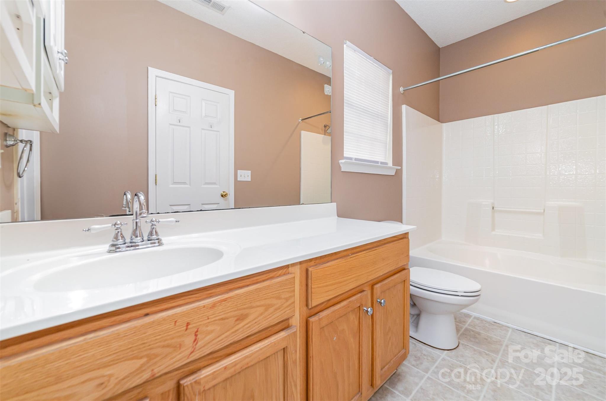168 Devon Forest Drive Mooresville, NC 28115 - Photo 17 of 21 a bathroom with a sink a toilet and shower