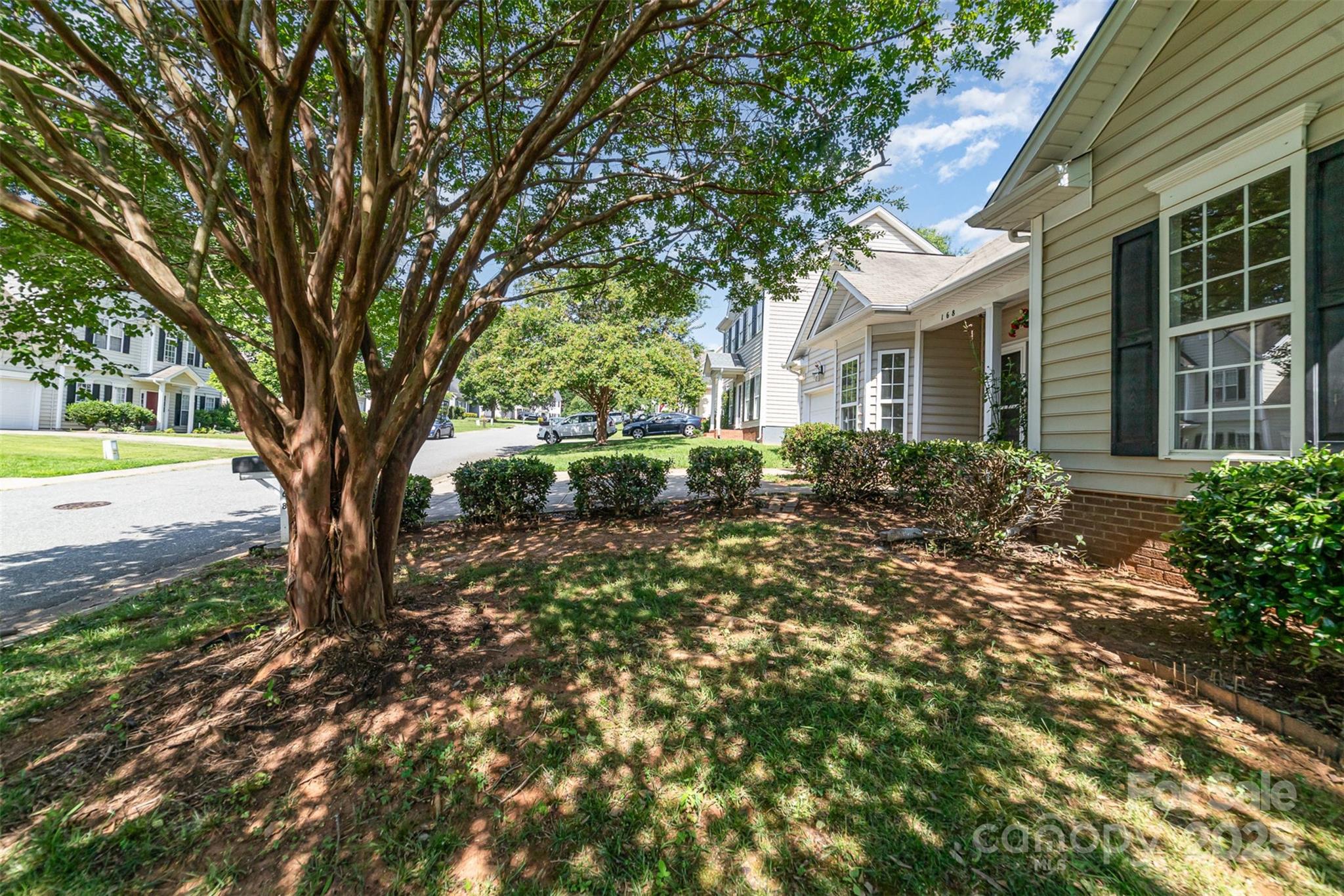 168 Devon Forest Drive Mooresville, NC 28115 - Photo 2 of 21 a front view of a house with garden