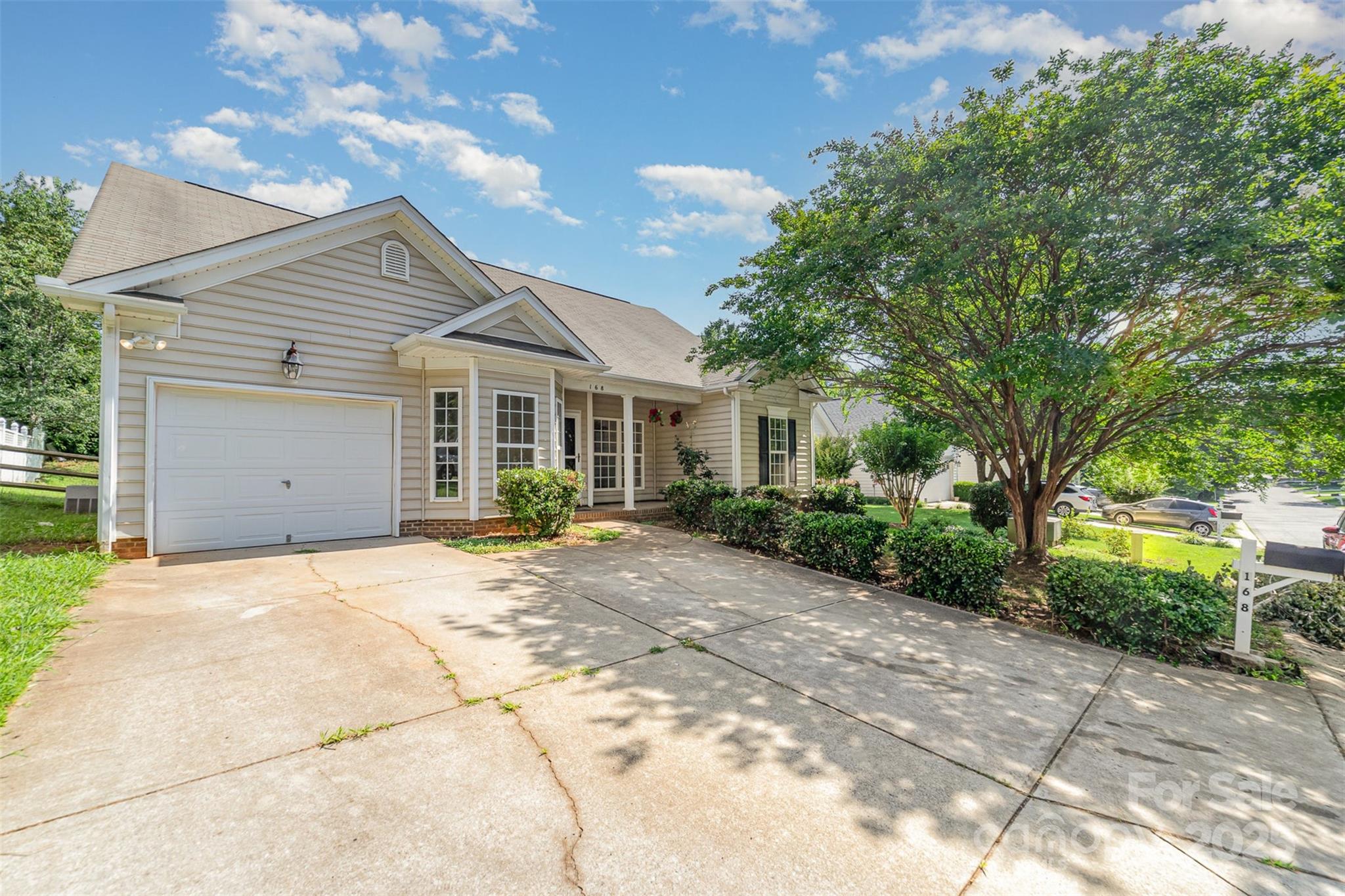 168 Devon Forest Drive Mooresville, NC 28115 - Photo 4 of 21 a view of a house with a garden