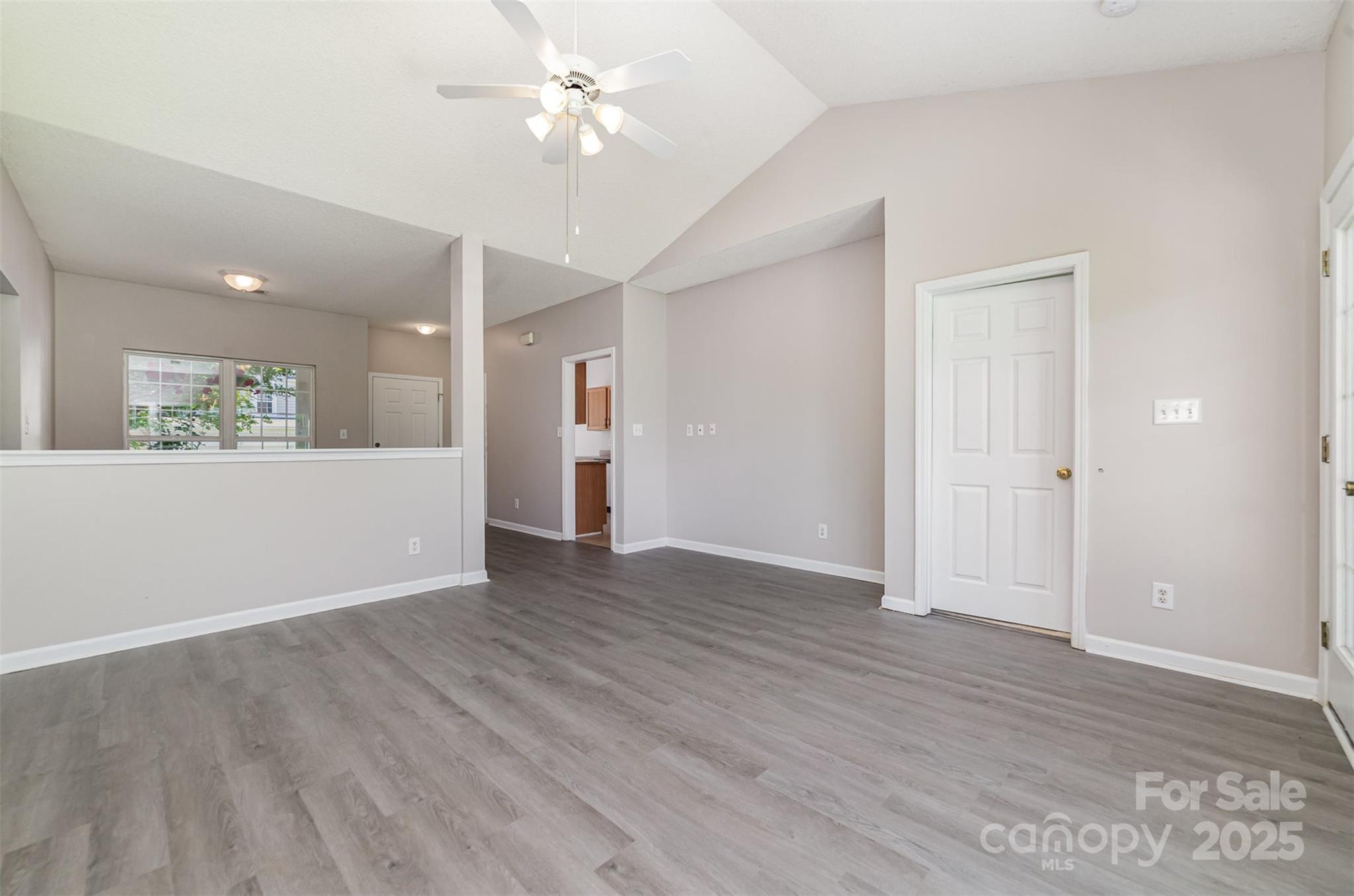 168 Devon Forest Drive Mooresville, NC 28115 - Photo 6 of 21 wooden floor in an empty room with a window