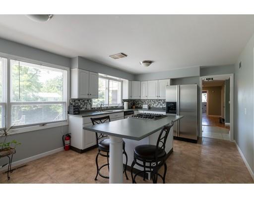 87 Hillview Road Holyoke, MA 01040 - Photo 10 of 26 a kitchen with a dining table chairs and window