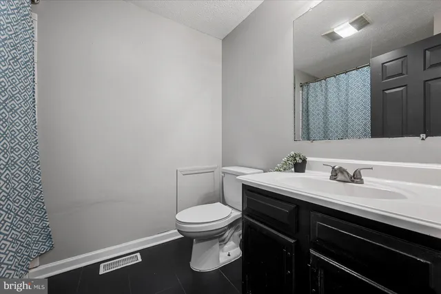 a bed room with furniture and a flat screen tv