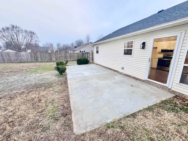 a view of a backyard of the house