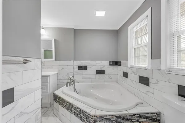 a bathroom with a shower and a sink