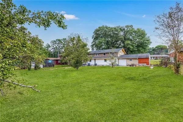 a backyard of a house with lots of green space