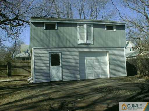 356 New Market Road Dunellen, NJ 08812 - Photo 2 of 8 a front view of a house with a yard