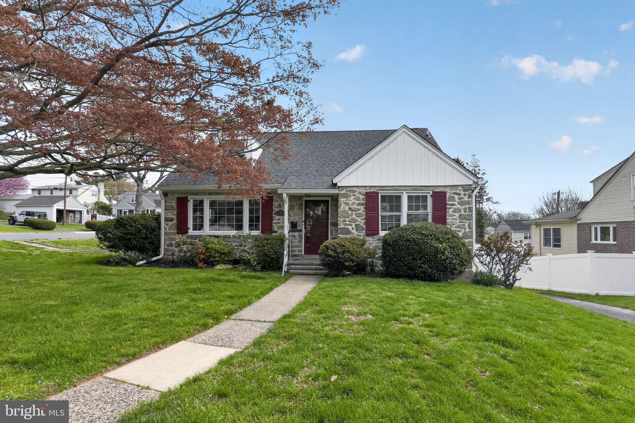 517 Weymouth Road Springfield, PA 19064 - Photo 1 of 31 a front view of a house with a yard and garage