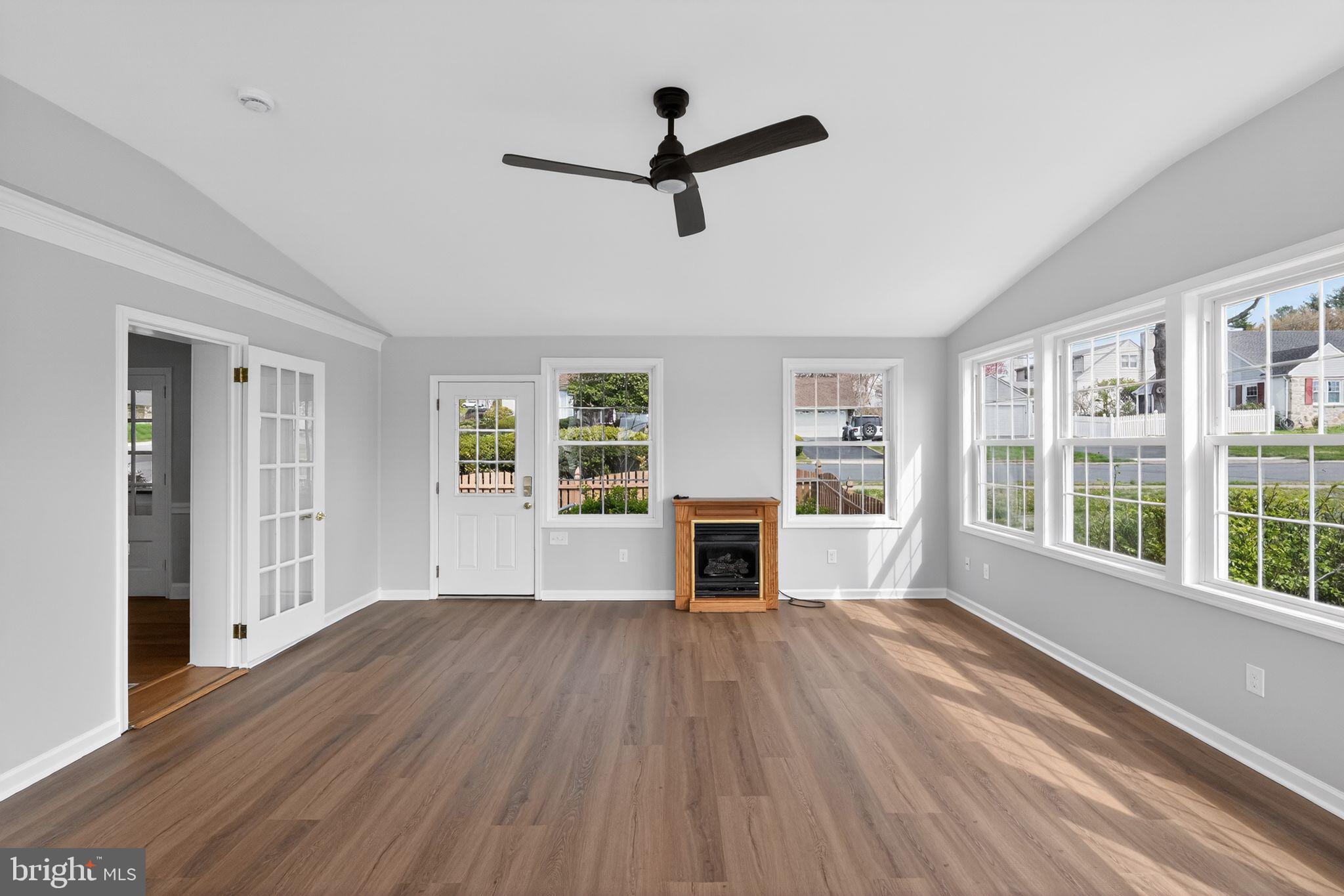 517 Weymouth Road Springfield, PA 19064 - Photo 11 of 31 a view of empty room with wooden floor and fan
